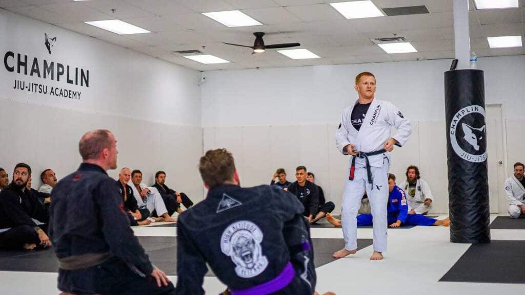 Drew Champlin Standing in the Front of his Students