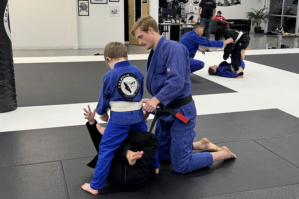 BJJ Coach Helping Kids